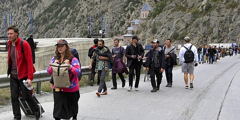 Moscow tries to draft fleeing Russian men at the borders