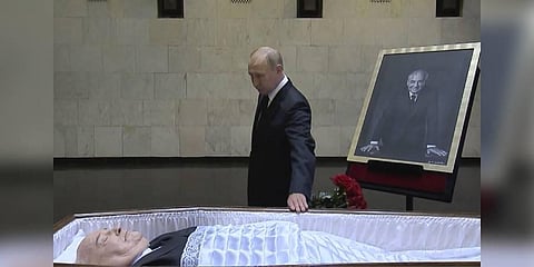 Russian President Vladimir Putin pays his last respect near the coffin of former Soviet President Mikhail Gorbachev at the Central Clinical Hospital in Moscow Russia. (Photo | AP)