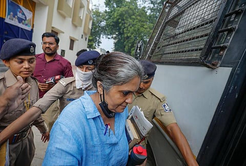 Social activist Teesta Setalvad being escorted to a session's court, in Ahmedabad, Saturday, Sept. 3, 2022. (Photo | PTI)