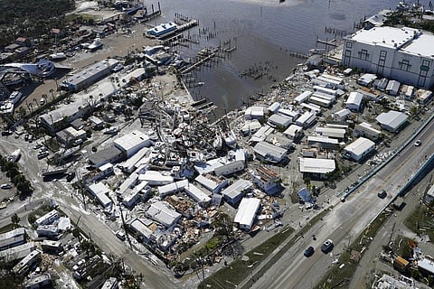 Damaged boats lie on the land and water in the aftermath of Hurricane Ian on Sept. 29, 2022, in Fort Myers, Florida (Photo | AP)