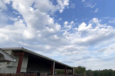 A small airplane circles over Tupelo, Miss., on Saturday, Sept. 3, 2022. (Photo | AP)