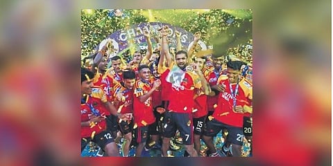 Champions celebrate with trophy. (Photo | Epress)