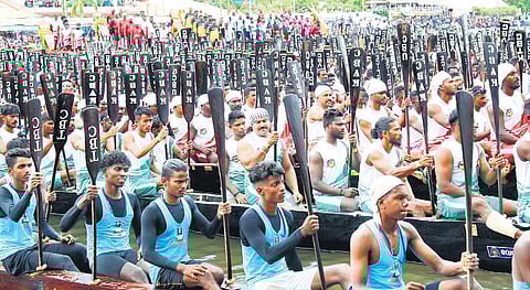 Rowers hold their oars high during the Nehru Trophy Boat Race mass drill in Alappuzha on Sunday | T P Sooraj