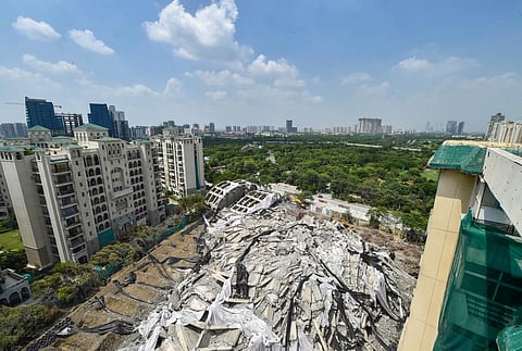 Debris lie on the ground near the site of the demolished twin towers of Supertech, in Noida, Wednesday Aug. 31, 2022. (Photo | PTI)