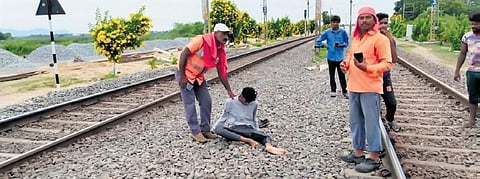 Railway personnel rush to help Akshay Raj who was hit by a train on Sunday.