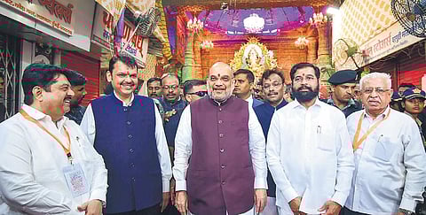 Union Home Minister Amit Shah with Maharashtra CM Eknath Shinde and Dy CM Devendra Fadnavis at a prominent Ganesh mandal in Mumbai on Monday. (Photo | PTI)9