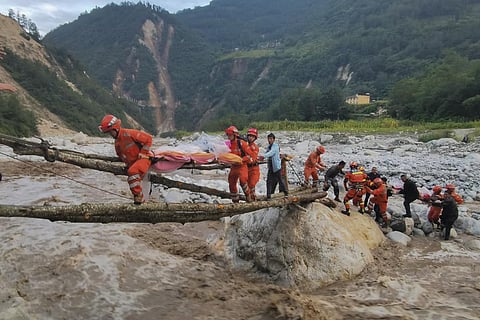 Rescuers transfer survivors across a river following an earthquake in southwest China's Sichuan Province. (Photo | AP)
