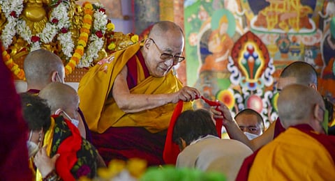 Tibetan spritual leader Dalai Lama gives blessings to devotees in Bodh Gaya, Bihar, on Jan 1, 2023. (Photo | PTI)