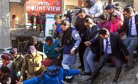 Uttarakhand Chief Minister Pushkar Singh Dhami inspects the landslide affected area of Joshimath, Uttarakhand. (Photo | PTI)