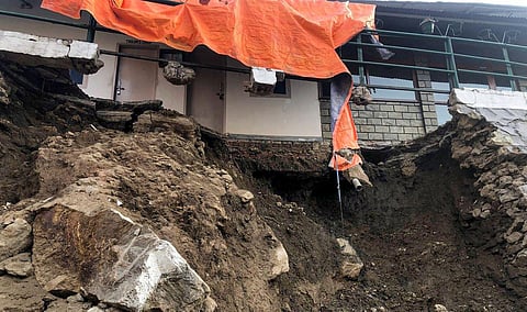 A collapsed part of a house due to landslides at Joshimath in Chamoli district of Uttarakhand. (Photo | PTI)