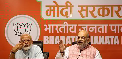PM Narendra Modi and Union Home Minister Amit Shah during a press conference at the BJP's headquarters in New Delhi. (File Photo | Shekhar Yadav, EPS)