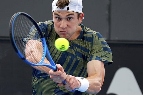 Great Britain's Jack Draper makes a backhand return to Russia's Karen Khachanov during their Round of 16 match at the Adelaide International Tennis. (Photo | AP)