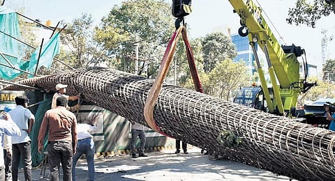 The collapsed skeletal structure of the under-construction Metro pillar being shifted