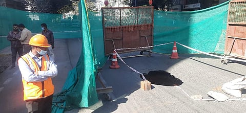 A big sinkhole developed on Brigade Road on Thursday in which a passenger on a two-wheeler is said to have suffered injuries after he allegedly fell into it. (Photo | Vinod Kumar T, EPS)