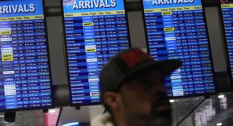 Flight status boards show delayed and cancelled flights at Harry Reid International Airport. (Photo | AP)
