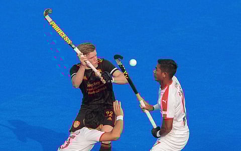 Netherland (Black) and Malaysia (White) players vie for the ball during the FIH Odisha Hockey Men's World Cup 2023. (Photo | PTI)