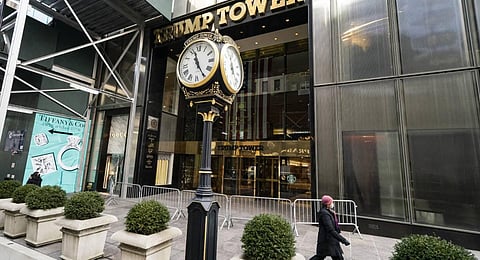 Pedestrians pass security barricades in front of Trump Tower. (Photo | AP)