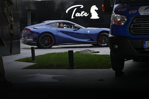 A luxury vehicle which was seized in a case against media influencer Andrew Tate, is towed away, on the outskirts of Bucharest, Romania on Jan. 14, 2023  | AP