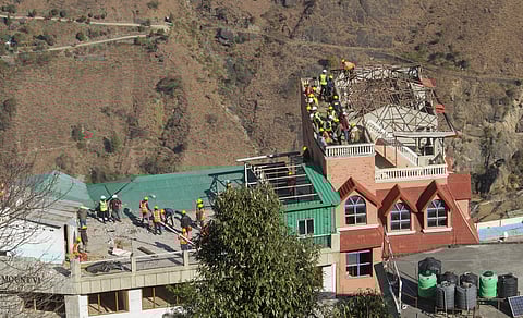 NDRF and SDRF teams carry out demolition of the Hotel Malari Inn, which has been marked unsafe, in Chamoli district, Uttarakhand (Photo | PTI)