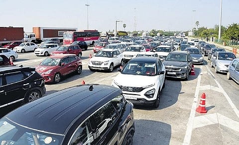 A file photo of vehicles, mostly cars, lined up at Panthangi toll plaza in the Rachakonda Commissionerate on Friday | Express