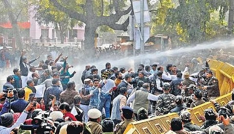 Police use water cannons on AAP protesters near BJP HQ on Saturday. (Photo | Shekhar yadav)