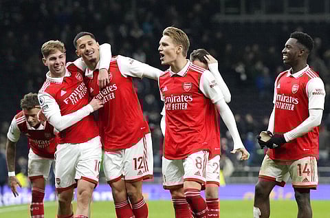 Arsenal players celebrate their victory at the English Premier League soccer match between Tottenham Hotspur and Arsenal at the Tottenham Hotspur Stadium in London, Jan. 15, 2023. (Photo | AP)