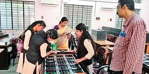 Students of Government Polytechnic College at Attingal in Thiruvananthapuram assembling an e-auto on the campus