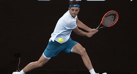 Taylor Fritz of the U.S. plays a backhand return to Nikoloz Basilashvili of Georgia during their first round match at the Australian Open.(Photo | AP)