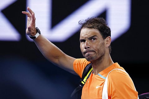 Rafael Nadal of Spain waves as he leaves Rod Laver Arena following his second round loss to Mackenzie McDonald of the U.S. at the Australian Open tennis championship. (Photo | AP)