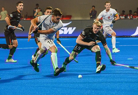 Belgium's Charlier Cédric vies for the ball during the FIH Hockey Men’s World Cup 2023 match between Germany and Belgium, at Kalinga Hockey Stadium, in Bhubaneshwar on Tuesday. (Photo | ANI)