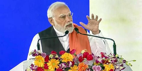 Prime Minister Narendra Modi speaks during the inauguration and foundation stone laying ceremony of various development projects, at Kodekal in Yadgiri district. (Photo | PTI)