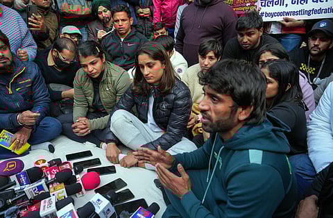 Vinesh Phogat with wrestlers Sakshi Malik and Bajrang Punia and others at a press conference regarding wrestlers' protest against the Wrestling Federation of India. (Photo | PTI)