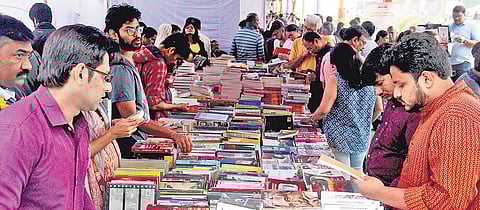 Visitors rummage through the plethora of books kept for sale on the concluding day of the Hyderabad Literary Festival 2019 in Hyderabad on Sunday.(File | S senbagapandiyan)