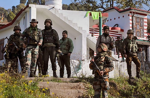 Army personnel stand near the house where an IED explosion took place, at Dangri village in Rajouri. (Photo | PTI)
