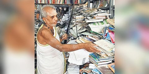 Sambamurthi (62) who runs a devotional book stall in Vijayawada. (Photo | Prasant Madugula, EPS)