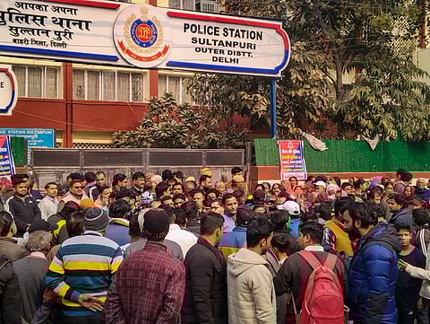 People gathered outside the Sultanpuri police station demanding stern punishment for men accused in Sultanpuri road accident, in New Delhi, on Jan 2, 2022. (Photo | PTI)