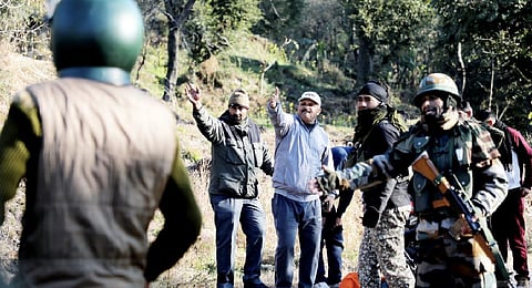 Security personnel and locals at the spot after an explosion at Dangri village in Rajouri district, Monday, Jan. 2, 2023. (Photo | PTI)