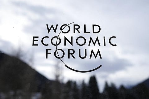 Logo of the World Economic Forum is displayed at a window at the Congress Center in Davos, Switzerland, Sunday, Jan. 15, 2023 