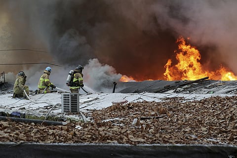 Firefighters battle a fire at Guryong village in Seoul, South Korea, Friday, Jan. 20, 2023. (Photo | AP)