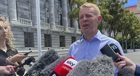 New Zealand Education Minister Chris Hipkins talks to reporters outside parliament in Wellington, New Zealand. (Photo | AP)