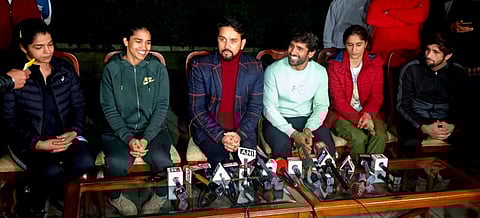 Union Sports Minister Anurag Thakur with wrestlers Bajrang Punia, Vinesh Phogat, Babita Phogat, Sakshi Malik and Ravi Dahiya at a press conference in New Delhi, Jan. 21, 2023. (Photo | PTI)