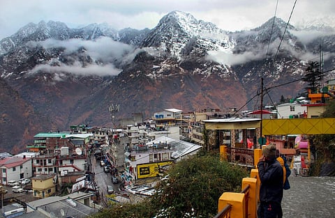 Snow-covered mountains amid rains in land subsidence-hit Joshimath, Friday, Jan. 20, 2023. (Photo | PTI)