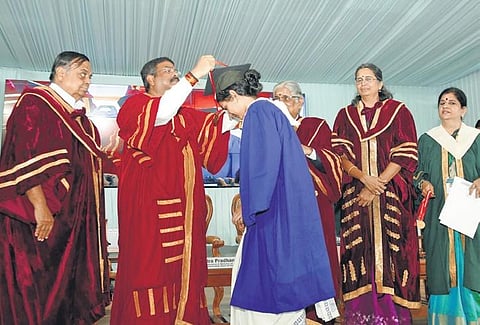 Union minister for education Dharmendra Pradhan honoured a rank holder at Avinashilingam Institute for Home Science in Coimbatore on Saturday | Express