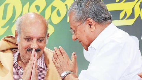 Pinarayi Vijayan greeting writer A Sethumadhavan during the Ezhuthachan Award presentation ceremony held at the Town Hall in Kochi on Saturday | T P Sooraj