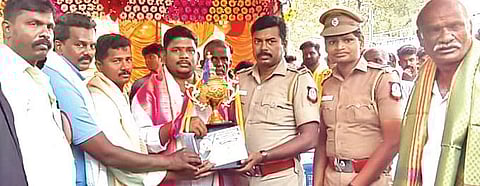Vijay receives the trophy at the cockfight tourney in RK Pet of Tamil Nadu | Express