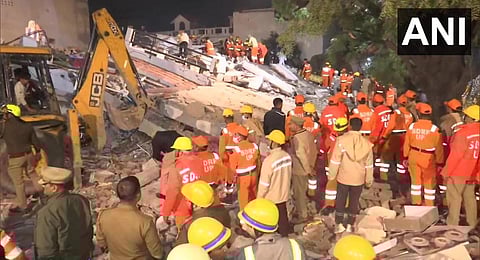 Rescue operation underway after a residential building collapsed on Wazir Hasanganj Road in Lucknow. (Photo | ANI Twitter)