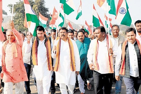 Union Education Minister Dharmendra Pradhan and other BJP leaders at a rally