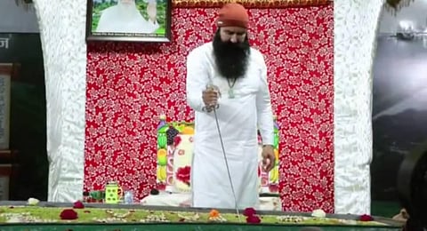 Dera Sacha Sauda chief Gurmeet Ram Rahim was seen 'celebrating' by cutting a cake with a sword. (Photo | ANI)