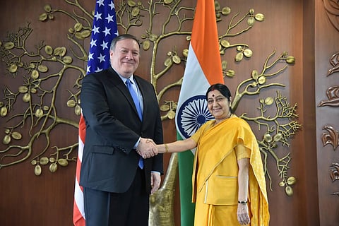 A file photo of US Secretary of State Mike Pompeo (L) shaking hands with India's Foreign Minister Sushma Swaraj prior to a meeting in New Delhi, Sept. 6, 2018. (Photo | AFP)
