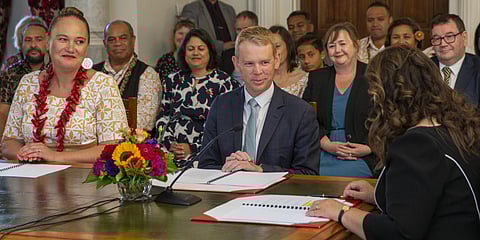 Chris Hipkins, center, is sworn in as New Zealand's next prime minister.(Photo | AP)
